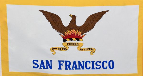 The San Francisco Flag - This photo captures the San Francisco city flag in detail, highlighting its bold colors and symbolism. The phoenix represents the city's ability to overcome adversity, while the fire signifies its passion and determination. The Spanish motto "Oro en Paz. Fierro en Guerra" translates to "Gold in Peace. Iron in War," reflecting San Francisco's commitment to prosperity and resilience. This flag is a symbol of city pride and a popular souvenir for visitors.