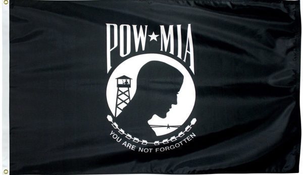 A black and white flag with the silhouette of a prisoner of war (POW) in white, standing in front of a guard tower and barbed wire. Above the figure is "POW" and "MIA" in white on either side of a five-pointed white star. Below the figure, a white wreath encircles the words "You Are Not Forgotten" in black.